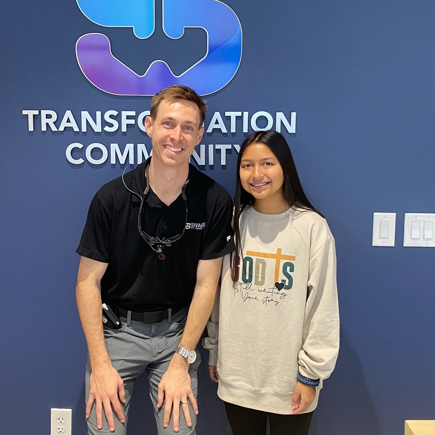 Dr. Savage with a happy patient.